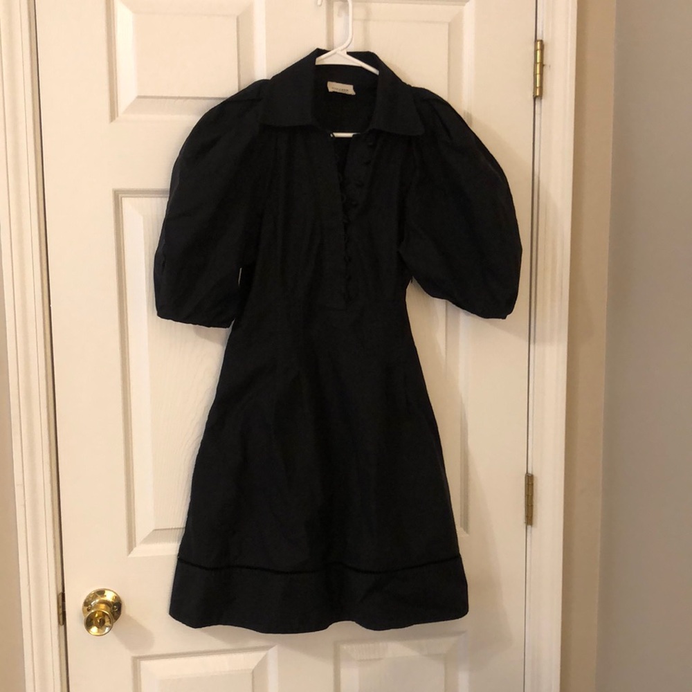 Khaite black cotton puff sleeve dress.